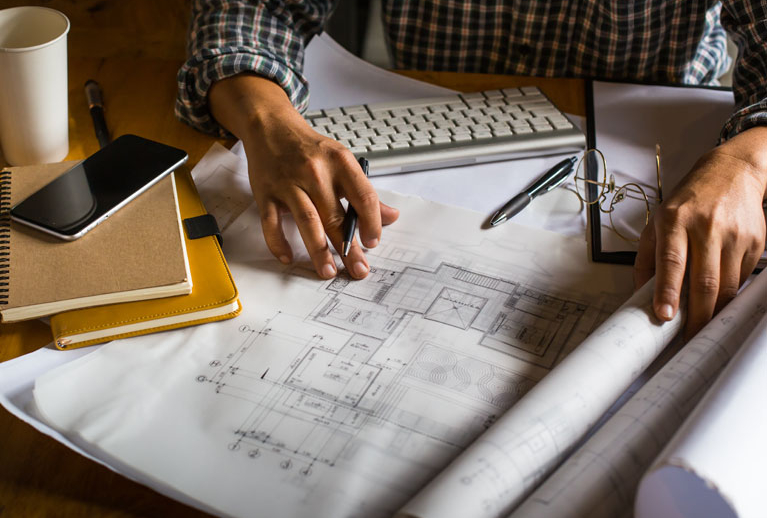 Creative Architect Projecting on Big Drawings