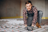 Service Man Installing House Heating System